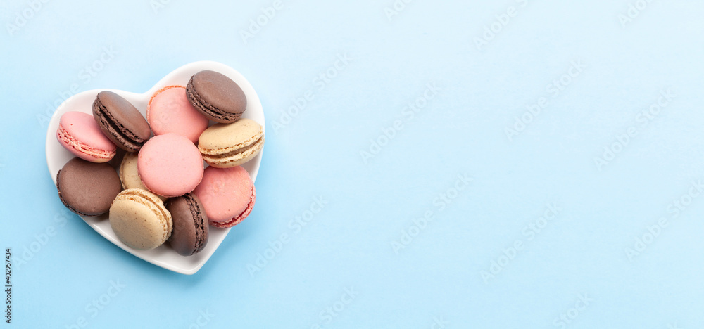Valentines day with macaroons in heart shaped plate Valentines day with macaroons in heart shaped plate