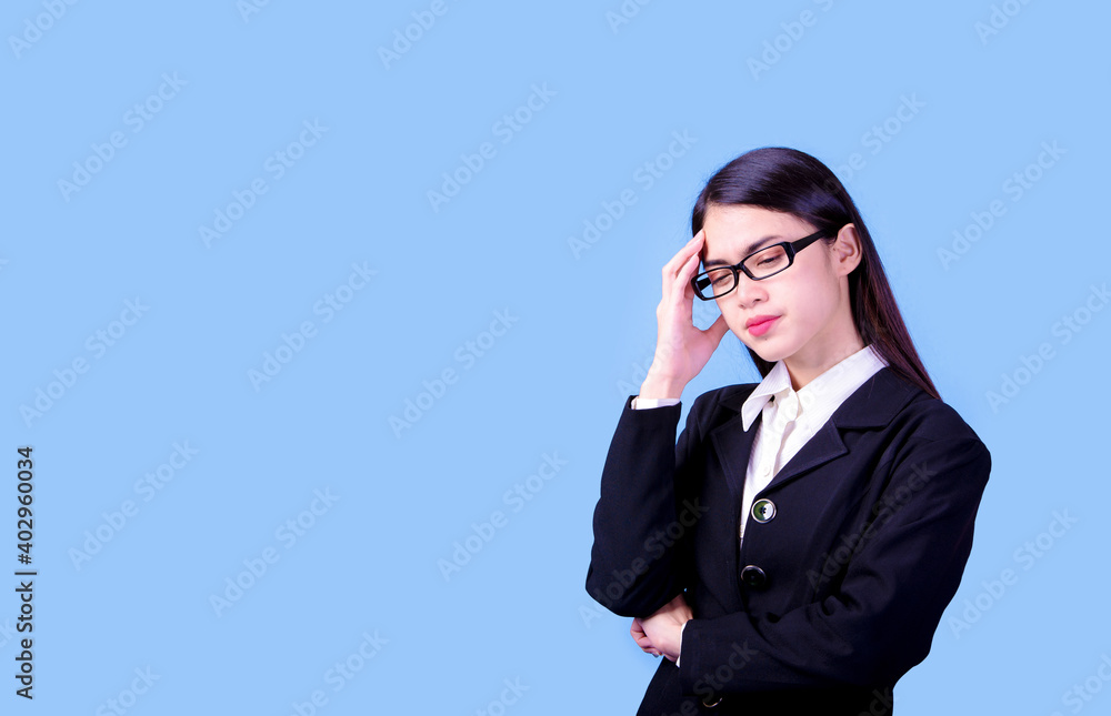 Businesswoman with a stern face on a blue background, studio portrait. Businesswoman with a stern face on a blue background, studio portrait.