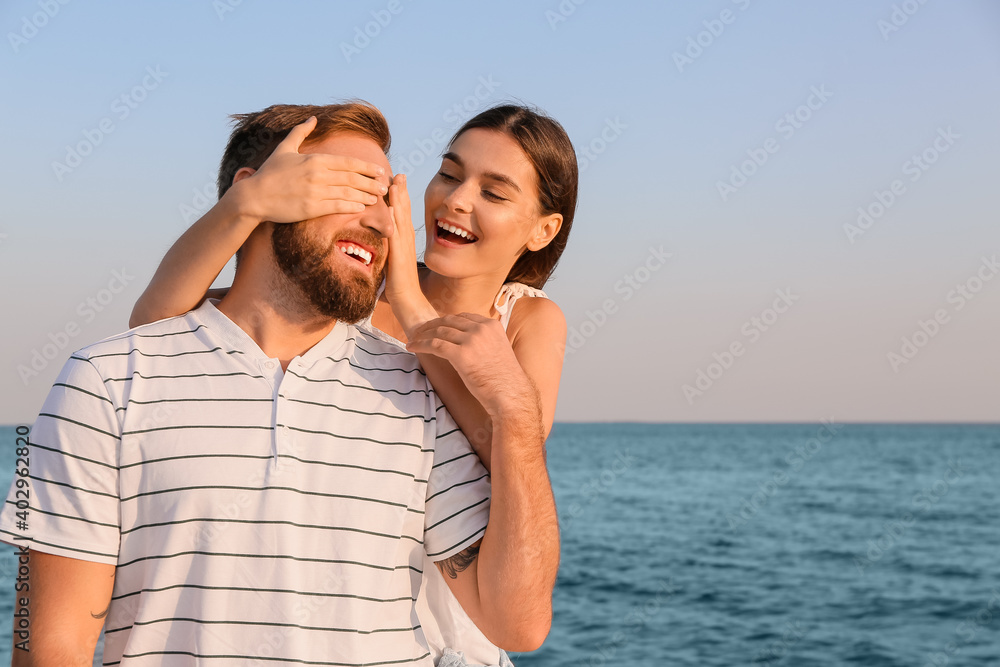 Happy young couple on sea beach Happy young couple on sea beach