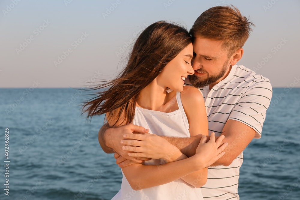 Happy young couple on sea beach