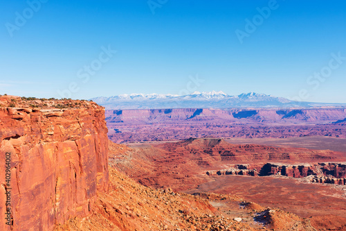 Scenic view of Colorado river canyon from Grand View Point Trail. The La Sal Mountains in the distance at Canyonlands National Park