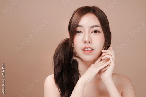 Asian beauty woman with natural makeup, cosmetic and plastic surgery concept, Isolated mocha brown background