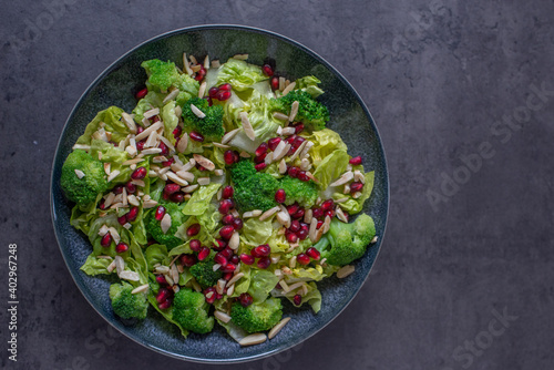 healthy tasty Broccoli salad with pomegranate on a table