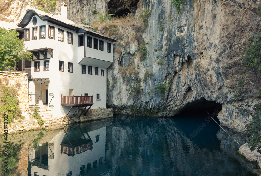 Beautiful view of the Dervish House under the rock in Blagaj. Bosnia and Herzegovina