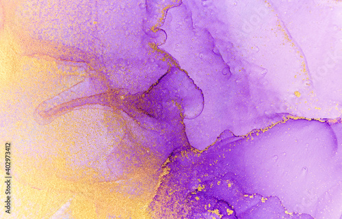 Abstract purple watercolor background. Violet and gold alcohol ink pattern.