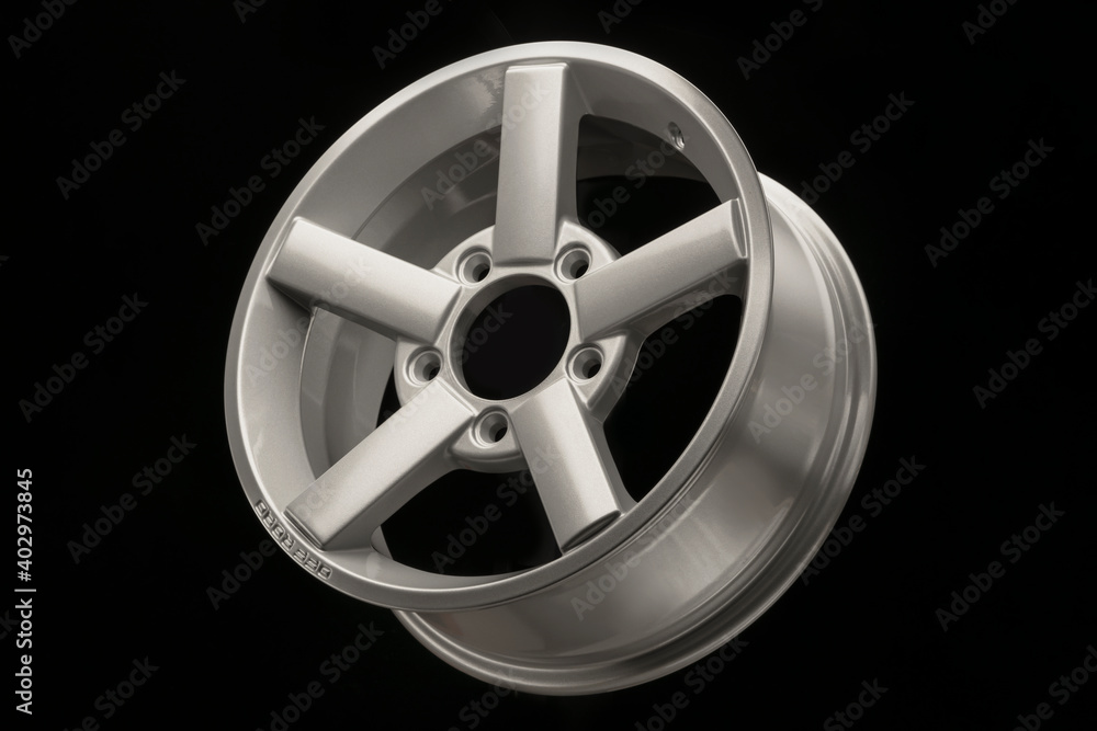 silver five-spoke alloy wheels rim for a crossover or SUV on a black background