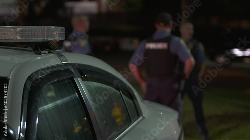 Police Officers Talking Next to Car Blurry 2 4K