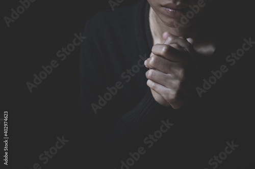  young human hands praying to god, Christian Religion concept background.