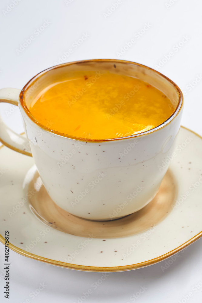 Cup with green tea over white background. Hot tea for cold weather. Cup with green tea over white background. Hot tea for cold weather.