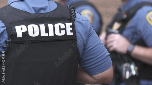 Police Officers at Meeting Outside OTS 4K