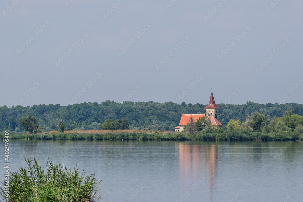 Flooded abandoned Church of Saint Linhart on a secluded island in the middle of a reservoir area of Moravia.