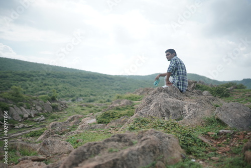 young man at hilly roads and mountains