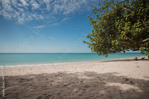 Beautiful beach and tropical ocean, sea and blue sky. © sarayutsridee