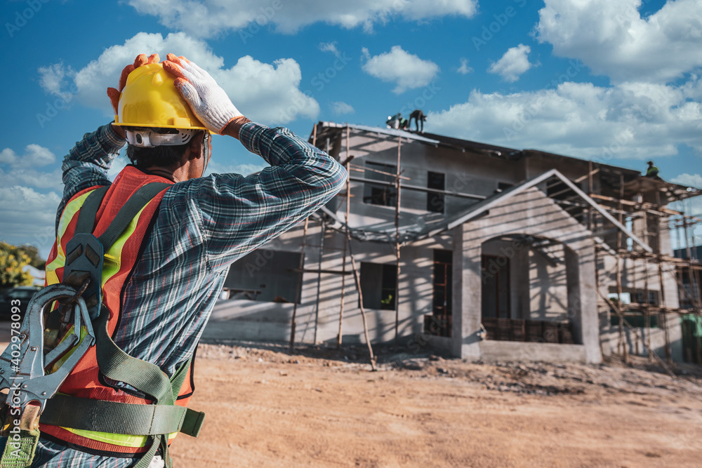 Asian men wearing safety clothing Construction worker helmets and reflective vests on construction sites Asian men wearing safety clothing Construction worker helmets and reflective vests on construction sites