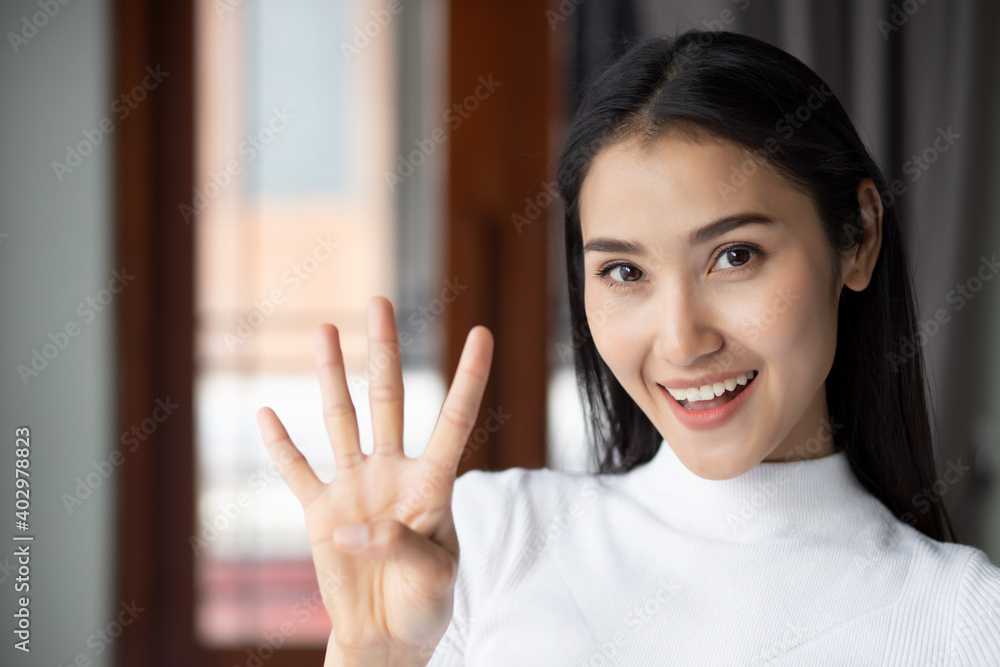 asian woman pointing, counting four finger, portrait of happy smiling asian woman pointing up 4 fingers for number four or 4 points concept by Chinese asian adult woman model, casual theme indoor asian woman pointing, counting four finger, portrait of happy smiling asian woman pointing up 4 fingers for number four or 4 points concept by Chinese asian adult woman model, casual theme indoor