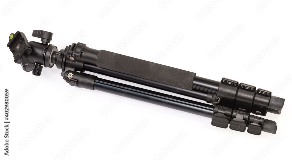 Folded tripod with ball head on a white background Folded tripod with ball head on a white background
