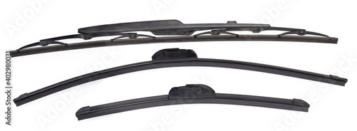 Pair of frameless windshield wipers blades against used traditional wiper