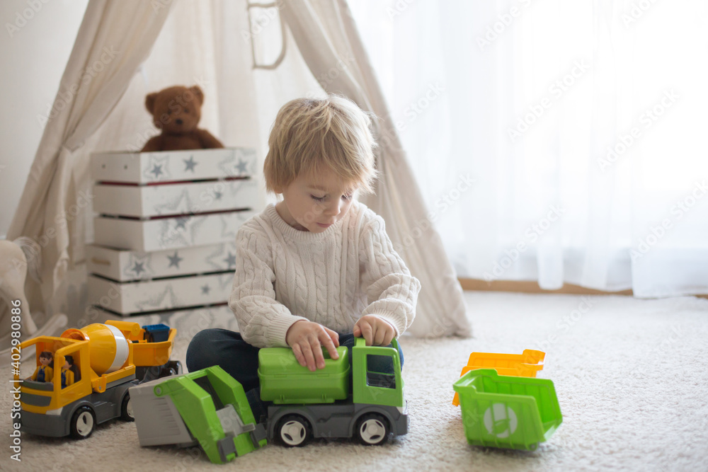 Cute toddler child, playing with toys at home Cute toddler child, playing with toys at home