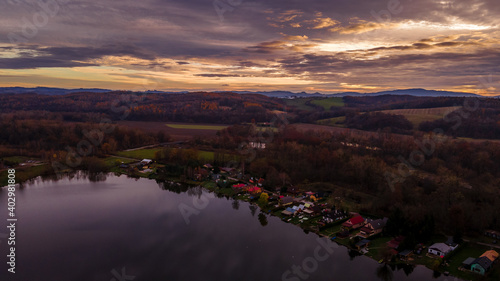 Aerial view of several divided ponds in a row during sunset in the area of Hustopece nad Becvou. © Lukas