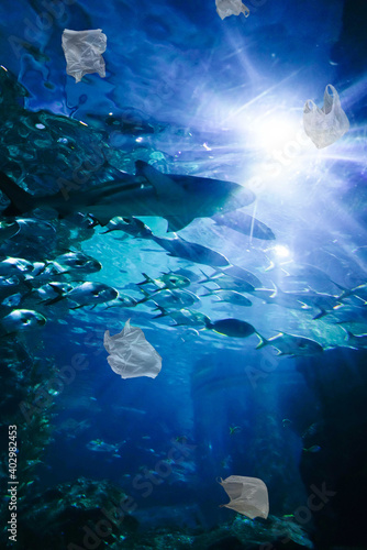 Photography garbage bag in ocean full of plastic trash to illustrate marine pollution problem