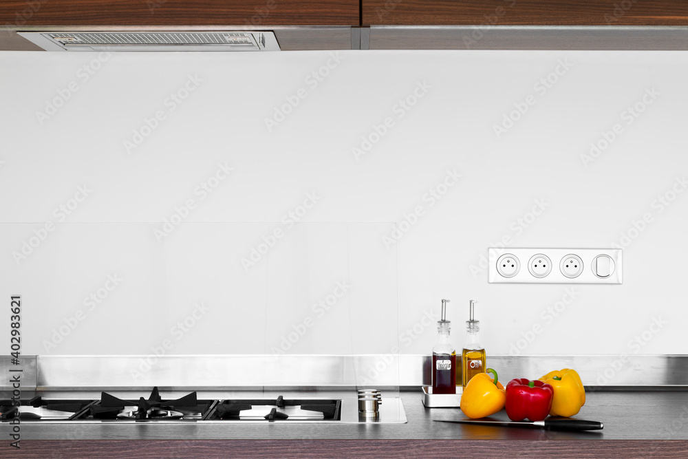 modern kitchen interior with utensils and peppers