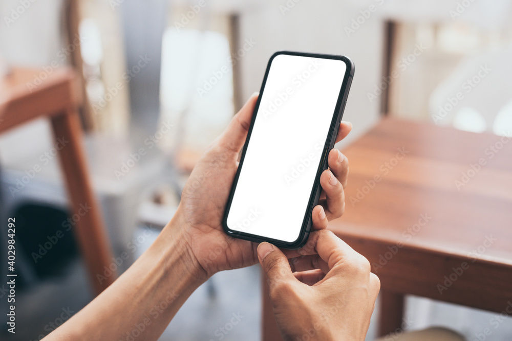 cell phone blank white screen mockup.woman hand holding texting using mobile on desk at office.background empty space for advertise.work people contact marketing business,technology cell phone blank white screen mockup.woman hand holding texting using mobile on desk at office.background empty space for advertise.work people contact marketing business,technology