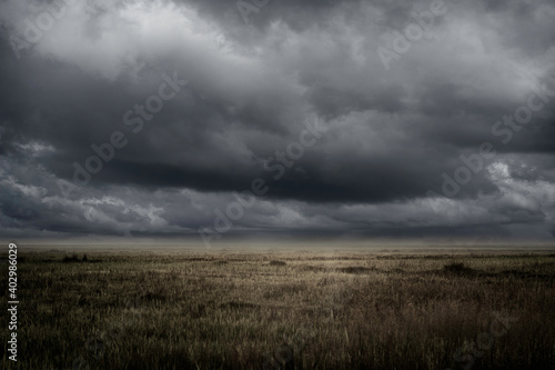 empty grassland and storm