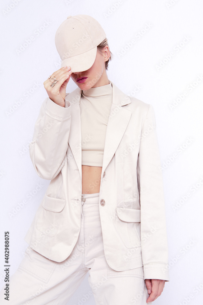 Fashion Urban Girl. Stylish Details of everyday outfit. Casual beige aesthetics.Trendy accessories velvet cap. Minimalistic style Fashion Urban Girl. Stylish Details of everyday outfit. Casual beige aesthetics.Trendy accessories velvet cap. Minimalistic style