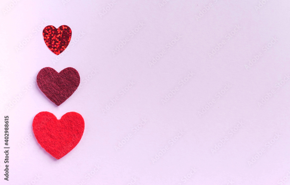 Flatlay red hearts on a pink background. Concept of Valentine's day, wedding. Copy space. Flatlay red hearts on a pink background. Concept of Valentine's day, wedding. Copy space.
