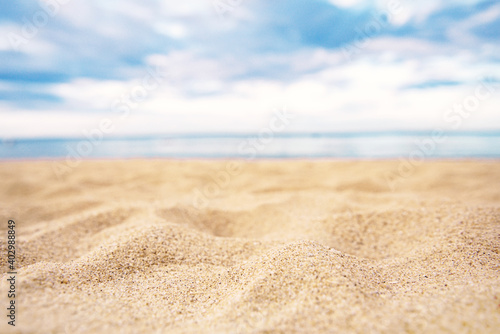 Tropical summer sand beach and bokeh sun light on sea background, copy space.