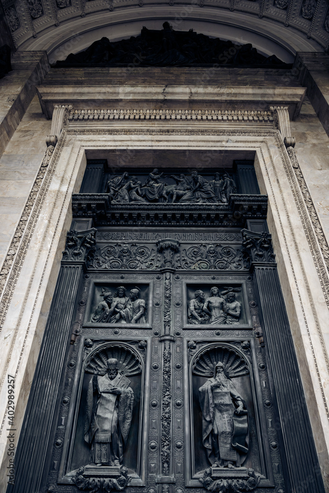 Antique (19th century) metal doors outside on the facade of the historic St. Isaac's Cathedral in St. Petersburg