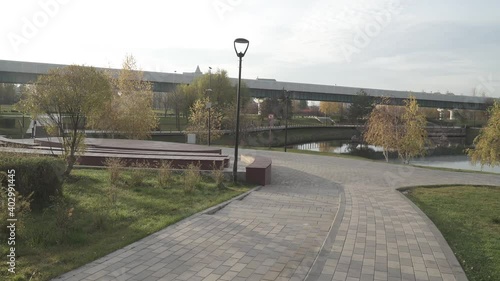 An alley in the park with a view of the Moscow metro