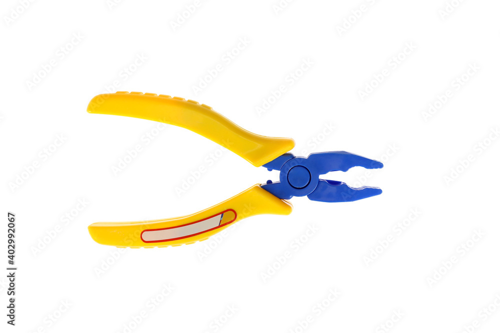 Fototapeta premium Toy pliers with a yellow handle. On a white background, isolated