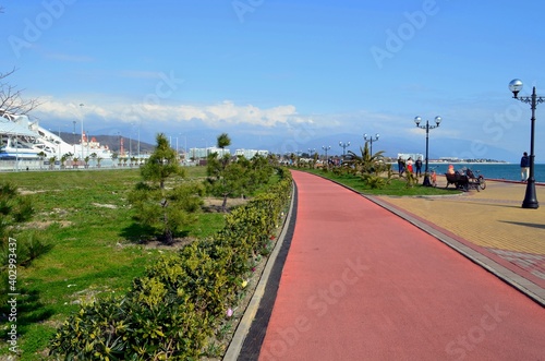 Embankment of a seaside resort town overlooking the sea and mountains