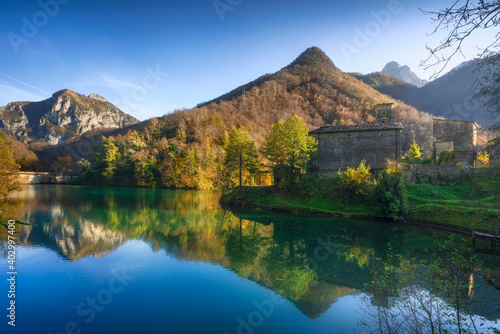 Isola Santa medieval village and lake in autumn foliage. Garfagnana, Tuscany, Italy.