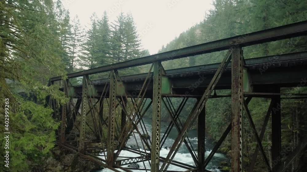 Climbing flight with pan down revealing railroad bridge and Lewis River Climbing flight with pan down revealing railroad bridge and Lewis River