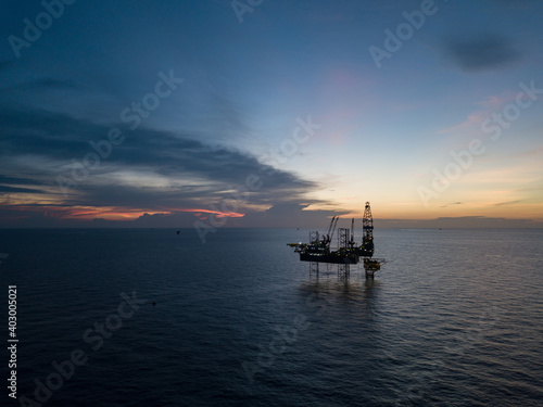 Aerial view offshore drilling rig (jack up rig) at the offshore location during sunset © bomboman