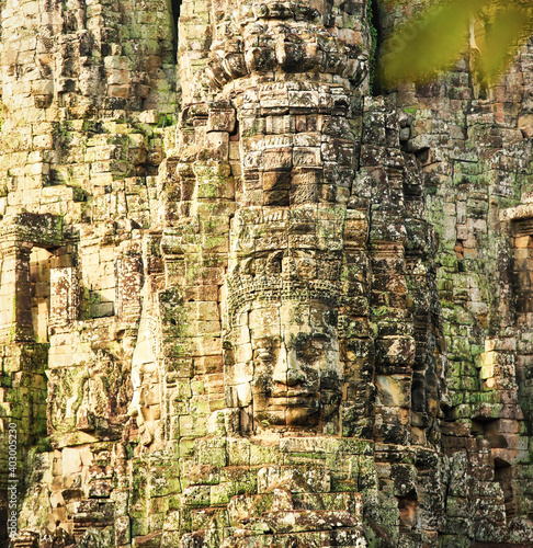 Smiling Faces of Bayon temple in Angkor Thom ancient ruin near Angkor Wat, Siem Reap, Cambodia photo