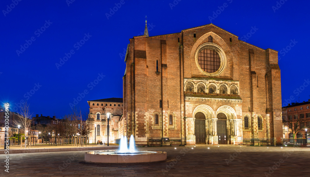 The Basilica of Saint Sernin illuminated at night, in Toulouse in Occitanie, France