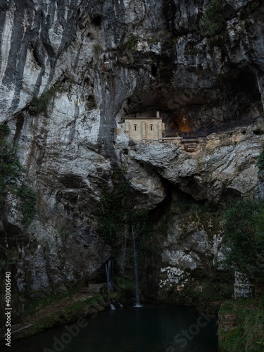 Religious catholic christian pilgrimage site Santa Cueva Holy Cave of Covadonga in rock wall waterfall Asturias Spain photo