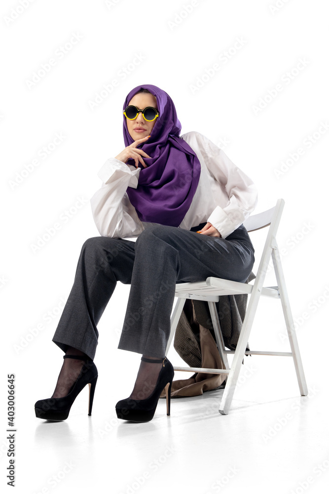 Business. Modern arab woman in stylish office attire isolated on studio background with copyspace for ad. Fashion, beauty, style concept. Female model with trendy make up, manicure and accessories. Business. Modern arab woman in stylish office attire isolated on studio background with copyspace for ad. Fashion, beauty, style concept. Female model with trendy make up, manicure and accessories.