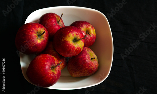 A bunch of healthy apples stacked together in a bowl