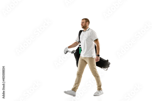 Going on. Golf player in a white shirt practicing, playing isolated on white studio background with copyspace. Professional player practicing with bright emotions and facial expression. Sport concept.