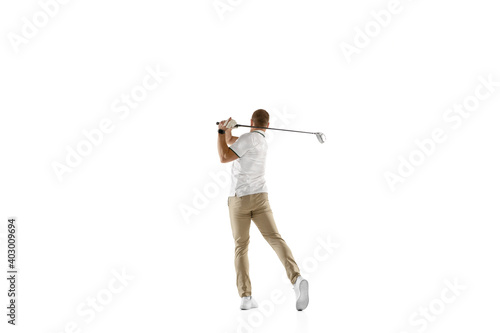 Achievement. Golf player in a white shirt taking a swing isolated on white studio background with copyspace. Professional player practicing with bright emotions and facial expression. Sport concept.