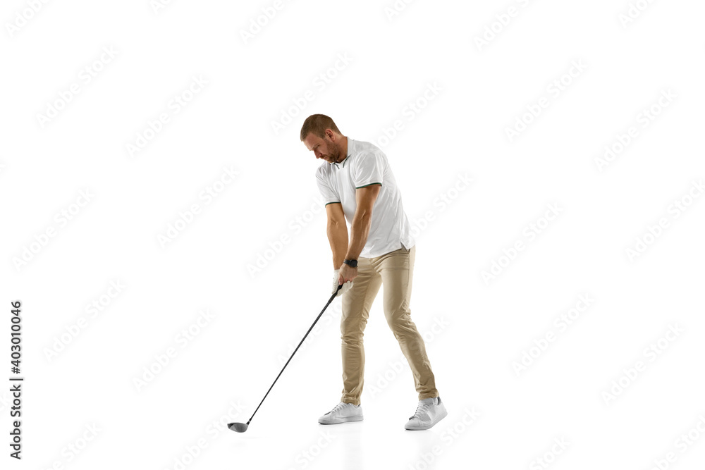 Checking. Golf player in a white shirt practicing, playing isolated on white studio background with copyspace. Professional player practicing with bright emotions and facial expression. Sport concept. Checking. Golf player in a white shirt practicing, playing isolated on white studio background with copyspace. Professional player practicing with bright emotions and facial expression. Sport concept.