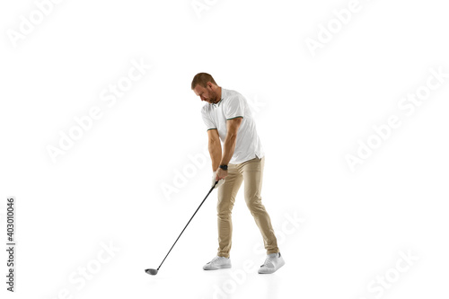 Checking. Golf player in a white shirt practicing, playing isolated on white studio background with copyspace. Professional player practicing with bright emotions and facial expression. Sport concept. © master1305