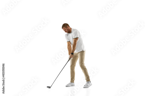 Checking. Golf player in a white shirt practicing, playing isolated on white studio background with copyspace. Professional player practicing with bright emotions and facial expression. Sport concept.