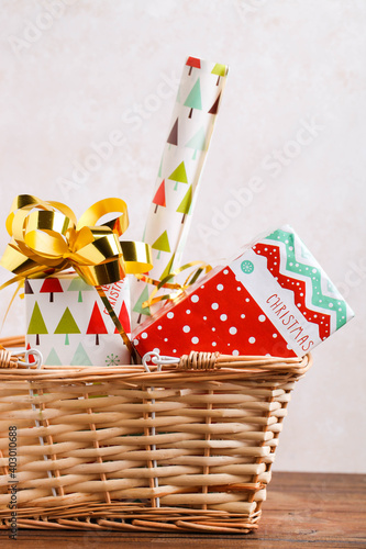 Wrapped Christmas gifts in a storage basket