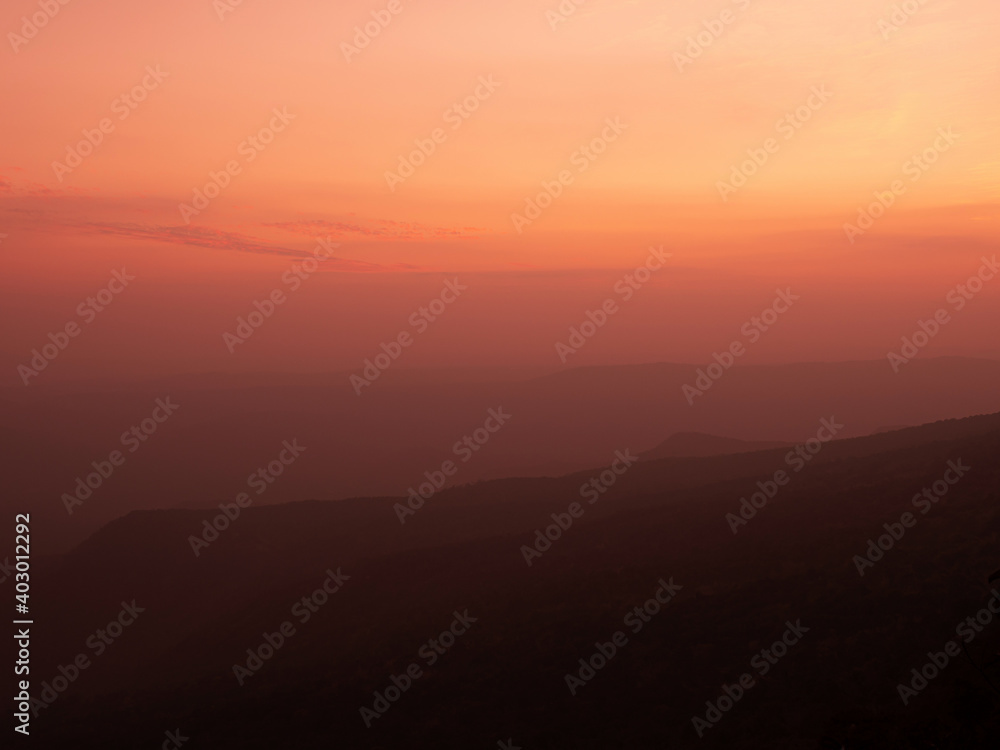 Dramatic sunset gradient shade mountain landscape of Phu Kradueng National park. Thailand. Warm tone image