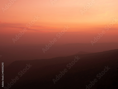 Dramatic sunset gradient shade mountain landscape of Phu Kradueng National park. Thailand. Warm tone image © PixHound